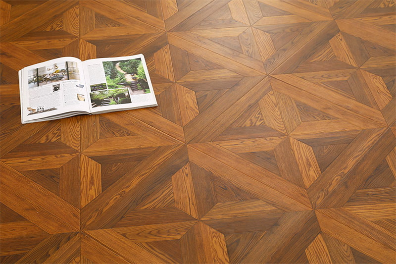 Versailles pattern laminate flooring planks showing registered embossed oak texture